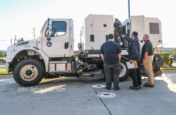 Occupational Safety and Health Administration officials were on the scene of a deadly incident involving a street sweeper. JOHN SPINK / JSPINK@AJC.COM