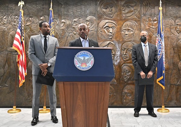 Atlanta Housing Authority President Eugene Jones speaks alongside Mayor Andre Dickens and Integral Group CEO Egbert Perry on Thursday, February 3, 2022. (Hyosub Shin / Hyosub.Shin@ajc.com)