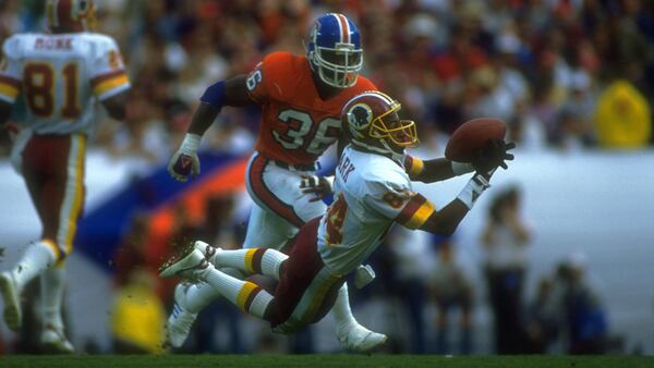 Washington Redskins wide receiver makes a diving catch over the Broncos in 1988.