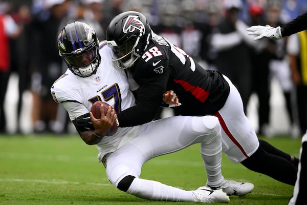 Baltimore Ravens quarterback Josh Johnson is sacked by Atlanta Falcons defensive tackle Ruke Orhorhoro during the first half of a game Saturday, Aug. 17, 2024, in Baltimore. (AP Photo/Nick Wass)