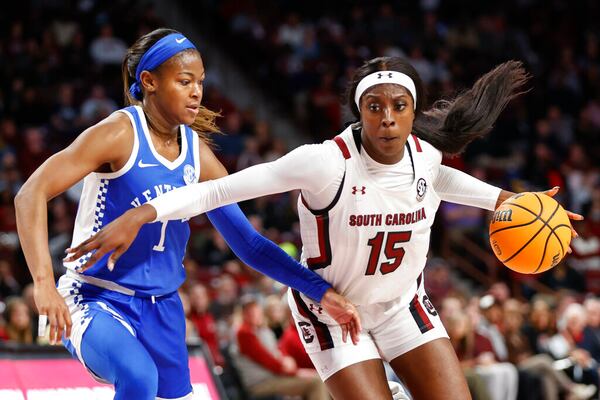 South Carolina forward Laeticia Amihere (15) drives against Kentucky guard Robyn Benton (1) during the first half of an NCAA college basketball game in Columbia, S.C., Thursday, Feb. 2, 2023. South Carolina won 87-69. (AP Photo/Nell Redmond)