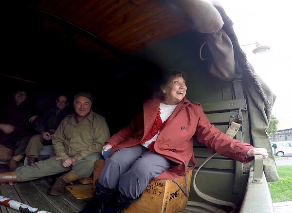 Shirley Sessions, the widow of Eddie Sessions, takes a ride in the back of a fully restored WWII U.S. truck. Sessions took part in a parade for veterans in the small town of Créhange, France. RYON HORNE/RHORNE@AJC.COM