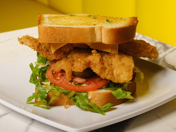 The menu at Bankhead Seafood includes an impressively sized fried fish sandwich on thick-sliced bread with lettuce, tomato, yellow cheese and pickles for $15. (Courtesy of Andrew Thomas Clifton)