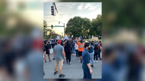 The crowd in Lawrenceville began to disperse as the city’s curfew neared Monday night.