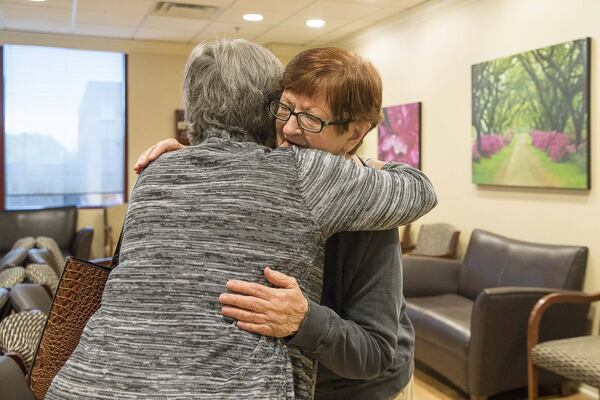 11/25/2019 — Fayetteville, Georgia — American Cancer Society’s Road To Recovery program driver Melissa Staton (left), 66, and Linda Wayman (right), 74, embrace before Linda’s chemotherapy appointment at the Piedmont Cancer Institute inside the Piedmont Fayette Hospital. (Alyssa Pointer/Atlanta Journal Constitution)