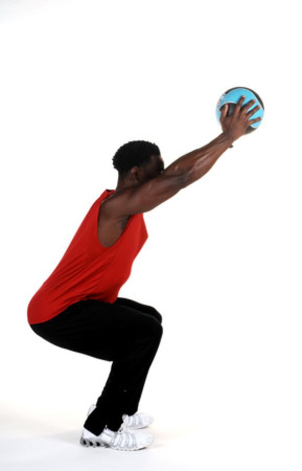 Squat with medicine ball press Squat (like sitting in a chair), and keep your hips back. Lower your hips straight down until your thighs are parallel to the floor.Tip: Keep your back straight and your chin up. Do not lean over or curve your back forward.