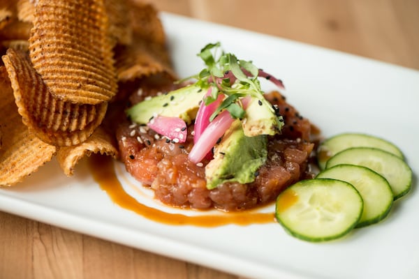  Tuna Tartar with ahi tuna, avocado, ponzu glaze, sesame, scallion, potato chips. Photo credit- Mia Yakel.