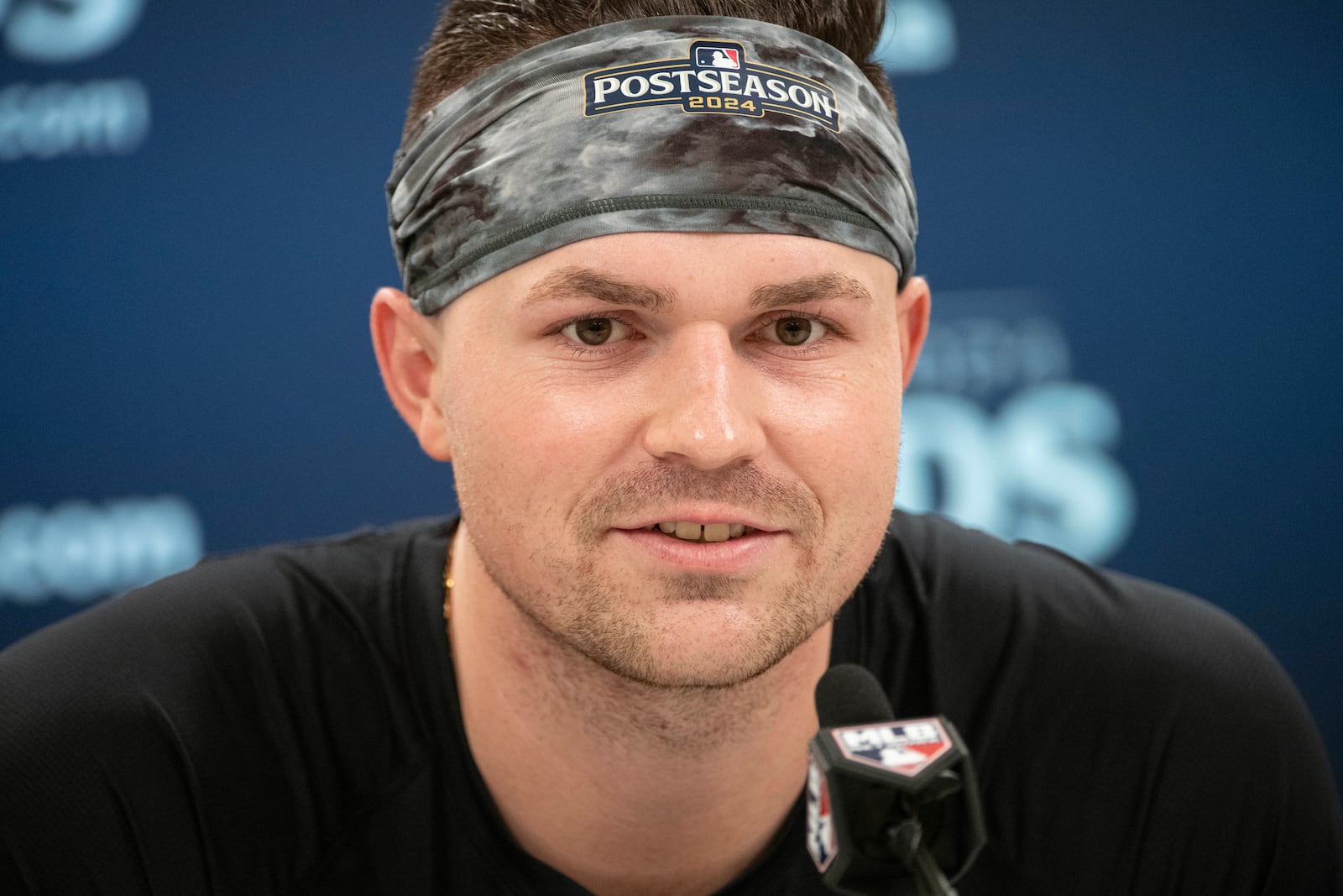 Detroit Tigers pitcher Tarik Skubal listens during a press conference before a baseball workout in Cleveland, Friday, Oct. 11, 2024, in preparation for Saturday's Game 5 of the American League Division Series against the Cleveland Guardians. (AP Photo/Phil Long)