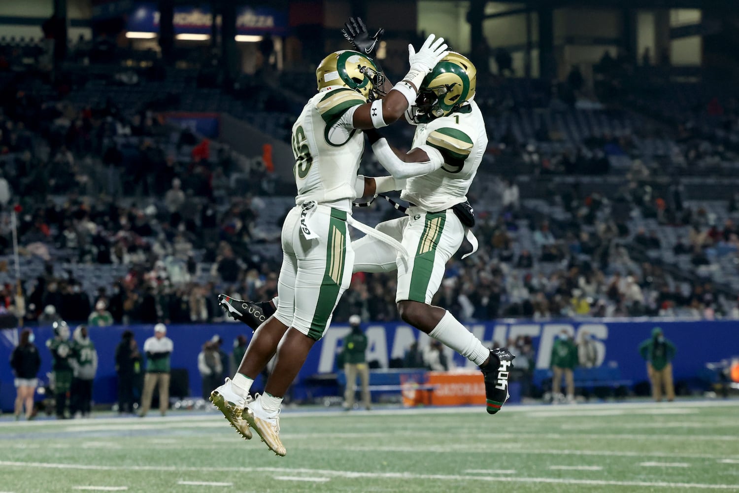 Grayson running back Jayvian Allen (16, left) celebrates a rushing touchdown with wide receiver Jamal Haynes in the first half against Collins Hill during the Class 7A state high school football final at Center Parc Stadium Wednesday, December 30, 2020 in Atlanta. JASON GETZ FOR THE ATLANTA JOURNAL-CONSTITUTION