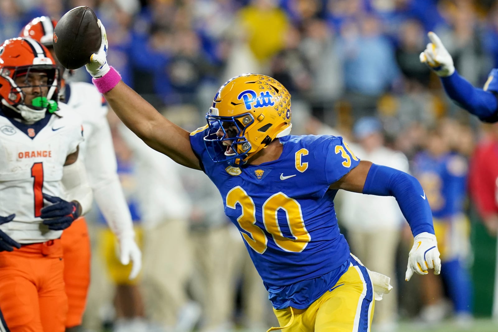 Pittsburgh linebacker Brandon George (30) celebrates after intercepting a ball during the first half of an NCAA college football game against Syracuse, Thursday, Oct. 24, 2024, in Pittsburgh. (AP Photo/Matt Freed)