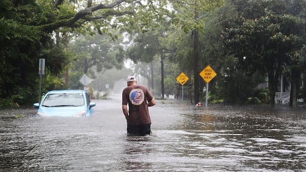 A man walks through a flooded street as Hurricane Matthew passes through the area on October 7, 2016 in St Augustine, Florida.  Florida, Georgia, South Carolina and North Carolina all declared a state of emergency in anticipation of Hurricane Matthew. (Photo by Joe Raedle/Getty Images)