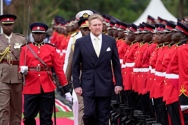 King Willem-Alexander of the Netherlands reviews the honor guard after arriving to meet with Kenya's President William Ruto at State House in Nairobi, Kenya, Tuesday, March 18, 2025. (AP Photo/Brian Inganga)