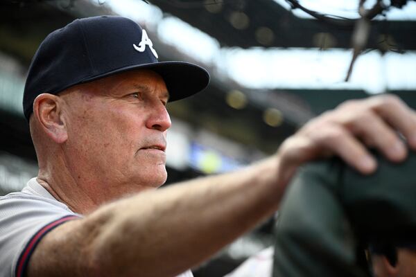 Atlanta Braves manager Brian Snitker watches from the dugout before the team's baseball game against the Baltimore Orioles, Wednesday, June 12, 2024, in Baltimore. (AP Photo/Nick Wass)