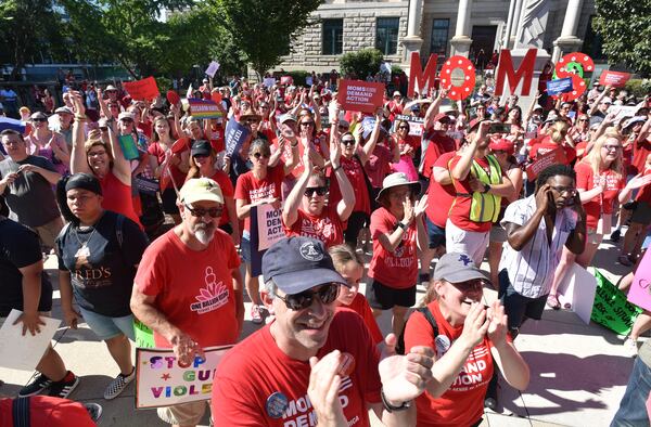 Rally participants react as  Indigo Girls performs during Recess Rally at Decatur Square on Saturday, August 17, 2019. Gun control groups held rallies in all 50 states this weekend to urge the Senate to pass universal background checks, and a strong Red Flag law.Organized by Moms Demand Action and Students Demand Action. (Hyosub Shin / Hyosub.Shin@ajc.com)