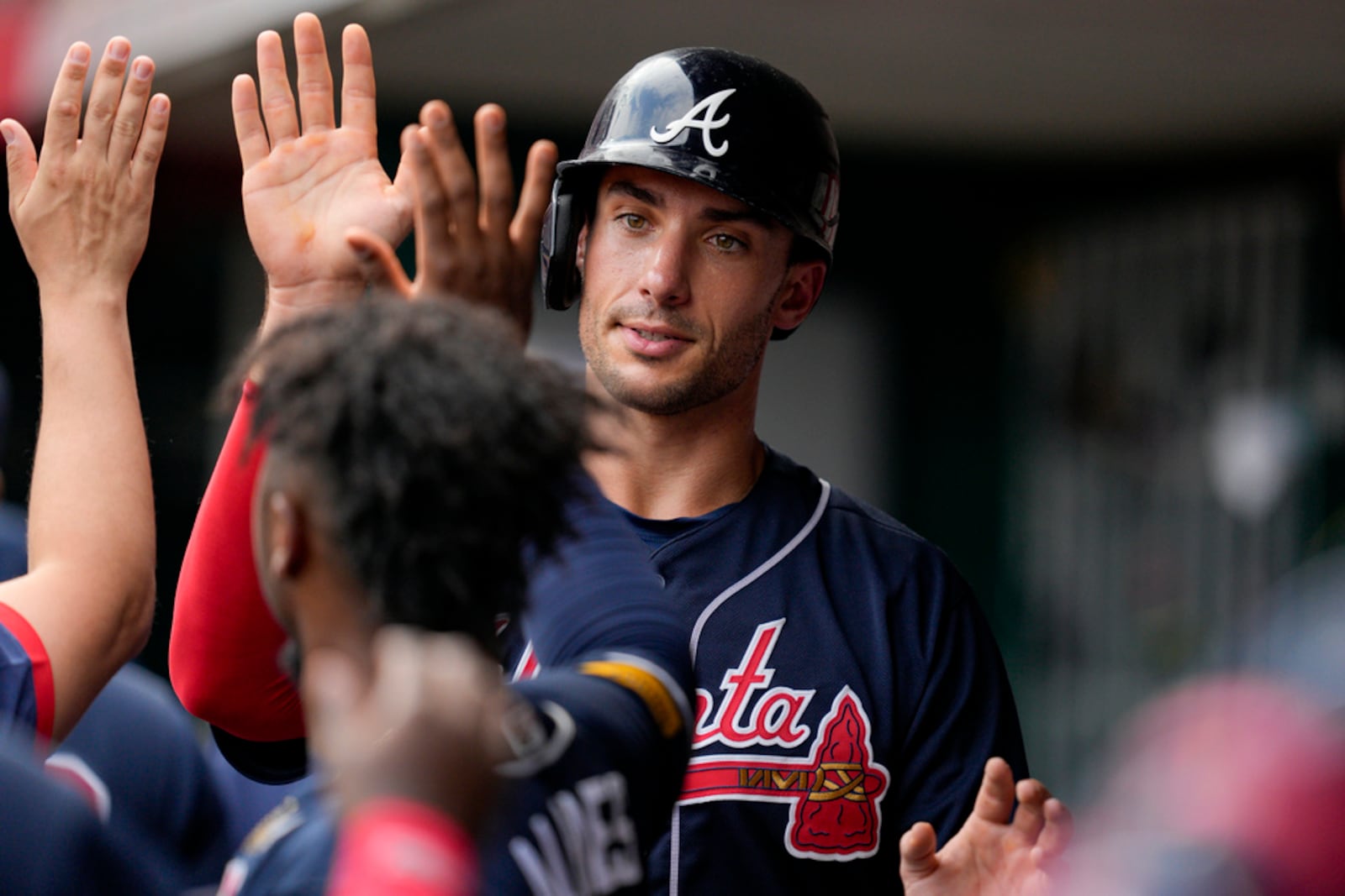 Atlanta Braves' Matt Olson celebrates with teammates after scoring on a single by Marcell Ozuna in the third inning of a baseball game against the Cincinnati Reds, Saturday, June 24, 2023, in Cincinnati. (AP Photo/Jeff Dean)