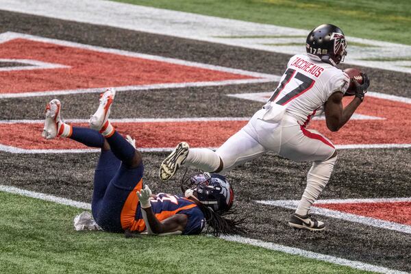 Falcons wide receiver Olamide Zaccheaus (17) catches the ball in the end zone for a touchdown during the first quarter Sunday, Nov. 8, 2020, at Mercedes-Benz Stadium in Atlanta. Zacchaeus made the catch despite being fouled on the play. (Alyssa Pointer / Alyssa.Pointer@ajc.com)