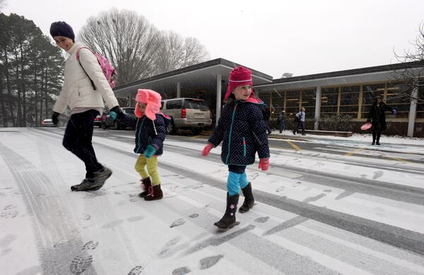 Sagamore Hills Elementary School students in DeKalb County leave school early as a major winter storm dumps 1 to 3 inches of snow on Georgia and the metro Atlanta area on January 28, 2014.