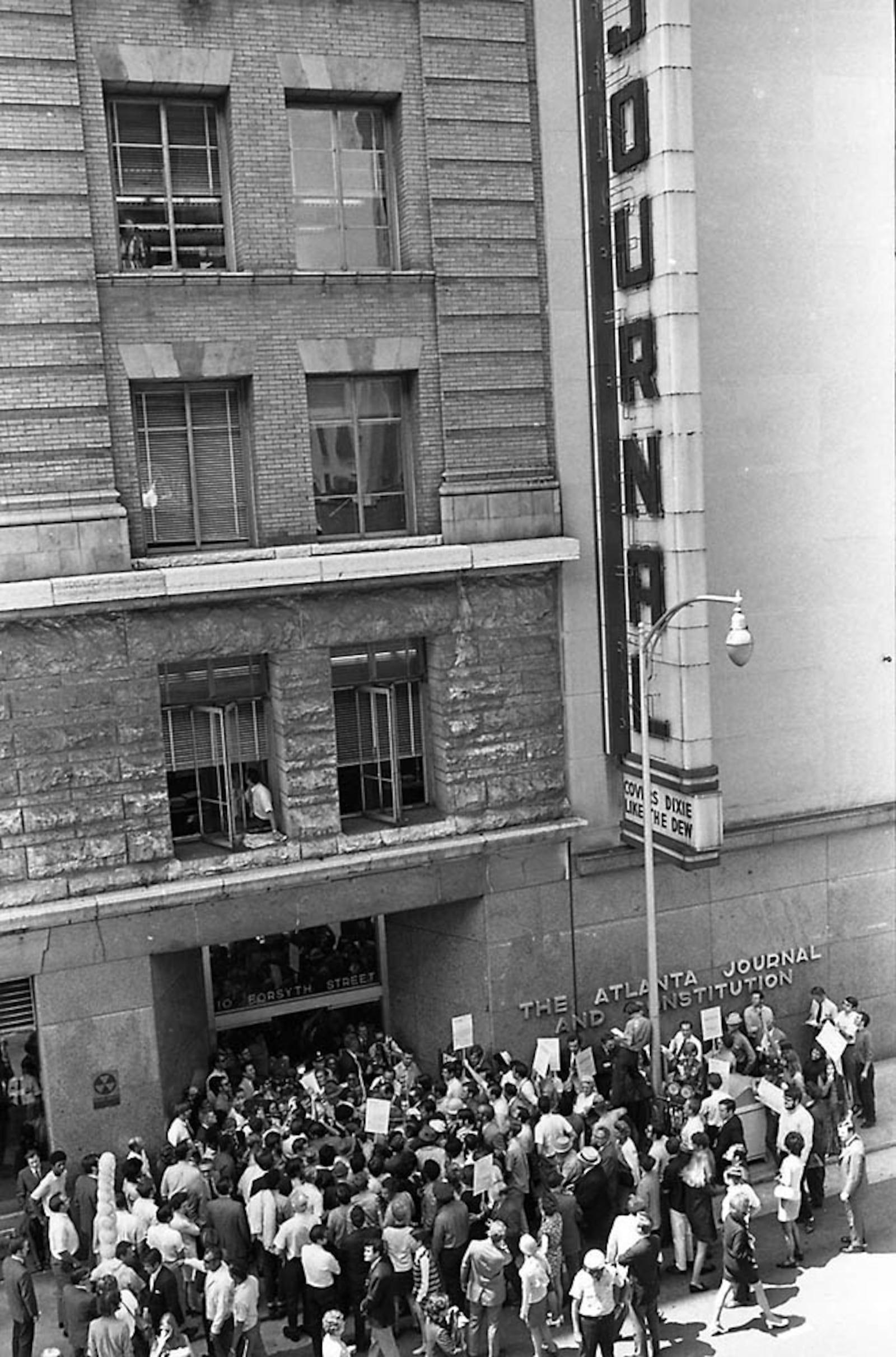 In this photo from 1970, Gov. Lester Maddox and supporters picket the front entrance of the 10 Forsyth building, which by then housed both the Journal and Constitution. (Charles R. Pugh, Jr., AJCNS1970-07-04u GSU Special Collections)