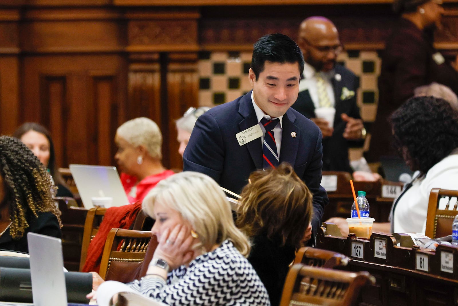 Minority Whip Sam Park (D) is seen talking with lawmakers before the session starts during Crossover Day on Thursday, Feb. 29, 2024. (Miguel Martinez / miguel.martinezjimenez@ajc.com)