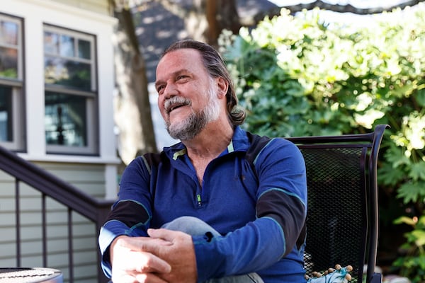 Rick Schroeder sits in his backyard where he creates various wood projects on Thursday, November 3, 2022. (Natrice Miller/natrice.miller@ajc.com)  