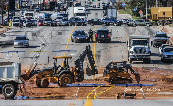 Buford Highway is flooded just north of I-285 in DeKalb County due to a water main break. JOHN SPINK / JSPINK@AJC.COM