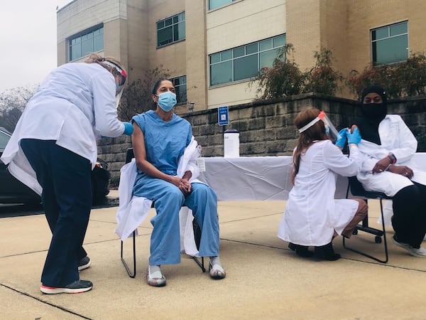 Dr. Gayla Dillard, left, and Dr. Sakina Peregrino-Brimah, right, received their vaccines at Piedmont Healthcare's first employee vaccination event in December. (Photo courtesy of Piedmont Healthcare)