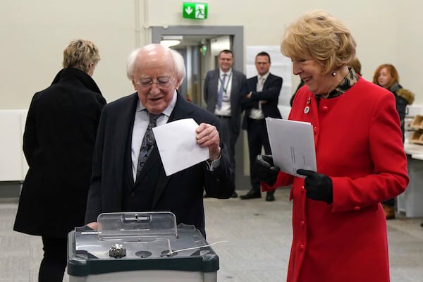 Irish President Michael D Higgins and his wife Sabina cast their votes for the 2024 General Election at St Mary's Hospital, Phoenix Park, Dublin, Friday, Nov. 29, 2024.(Brian Lawless/PA via AP)