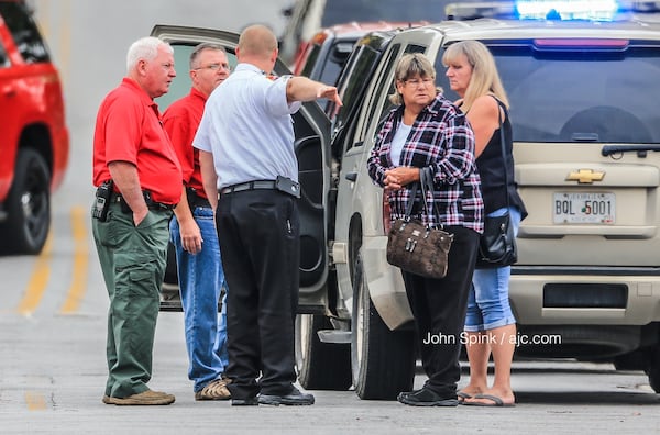 Authorities and others were on the scene of a  shooting   that left one man dead and sent two Forest Park police officers to hospitals.