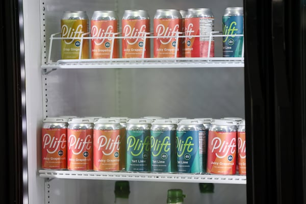 A collection of THC-infushed Plift drinks are shown in a refrigerator for purchase at the Georgia Hemp Company, Tuesday, March, 11, 2025, in Sandy Springs, Ga. The THC-infused drinks that Georgia Hemp Company sells could be banned under a bill pending in the Georgia General Assembly. (Jason Getz / AJC)