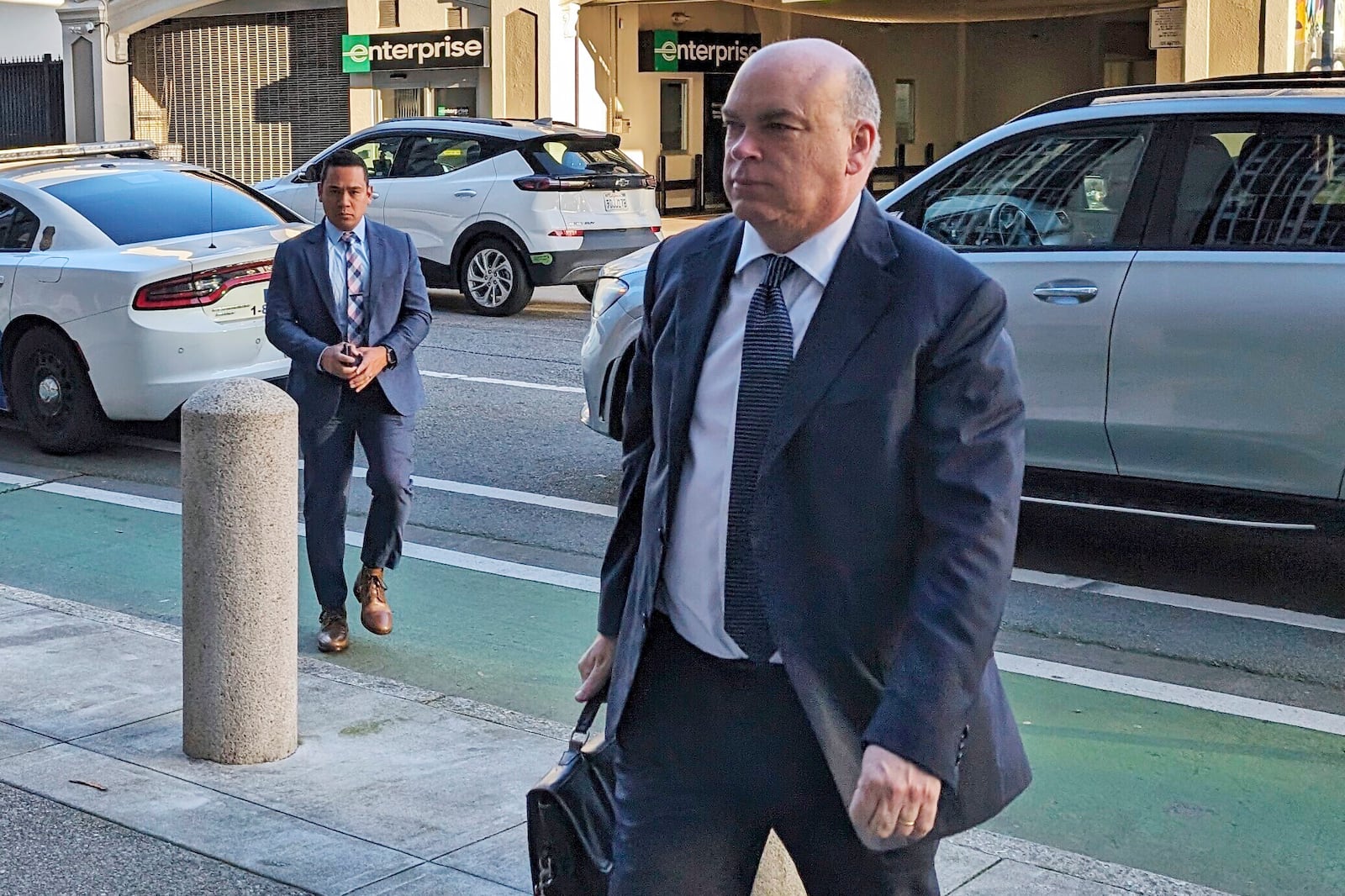 FILE - British tech magnate Mike Lynch walks into federal court in San Francisco, March 26, 2024, (AP Photo/Michael Liedtke, File)