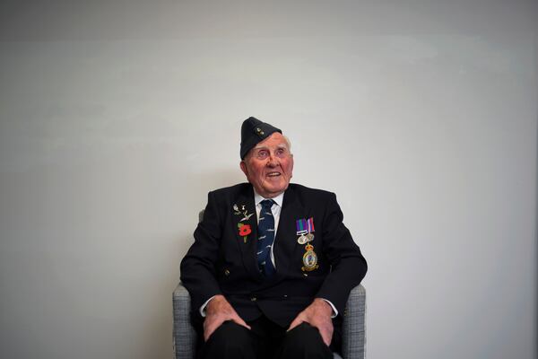 Michael Woods, 100-year-old World War II veteran, poses for a photograph during an interview in Dunstable, Bedfordshire, England, Tuesday, Nov. 5, 2024. (AP Photo/Kin Cheung)