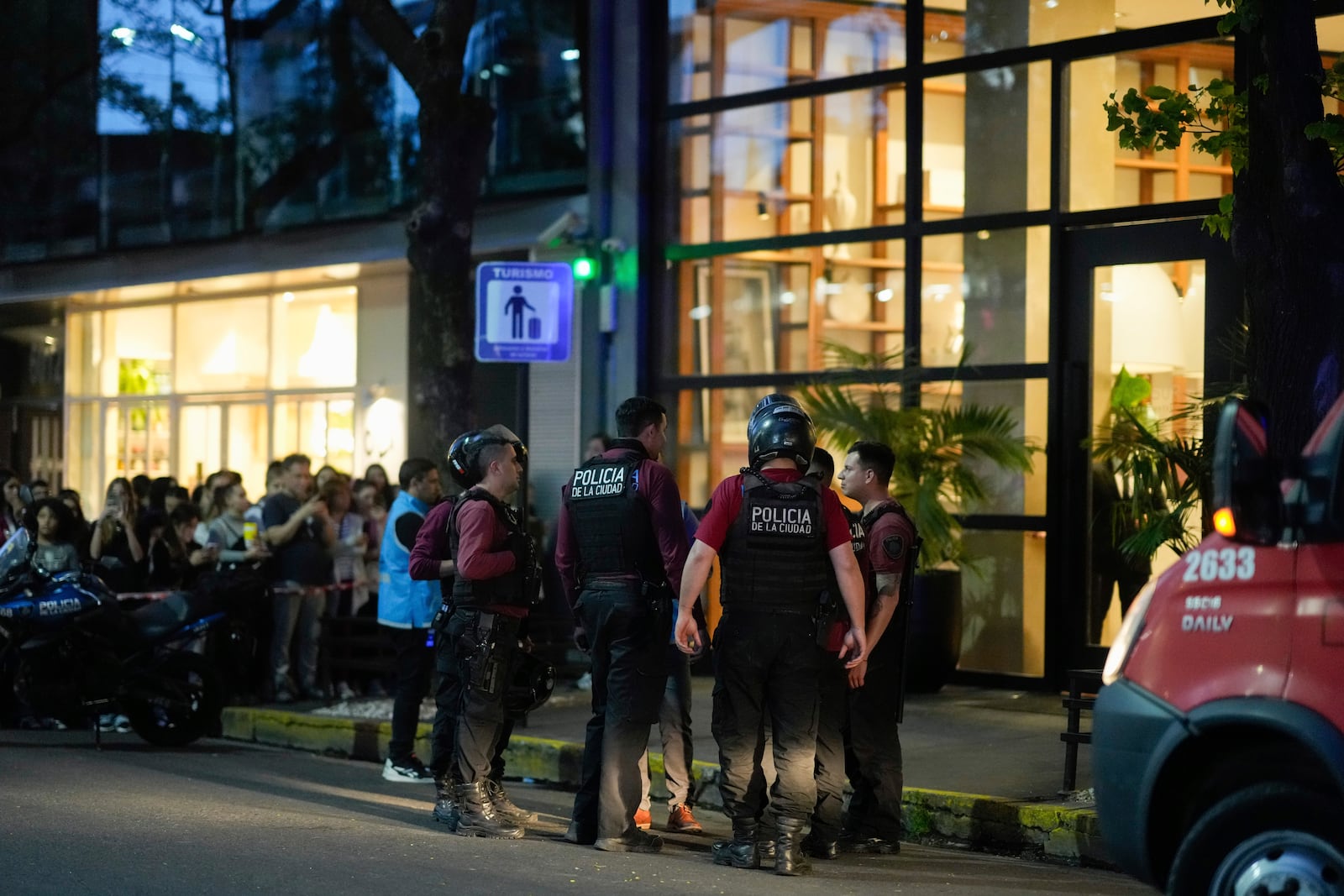 Police gather outside a hotel where Liam Payne, a former member of the band One Direction, was found dead after falling from a balcony in Buenos Aires, Argentina, Wednesday, Oct. 16, 2024. (AP Photo/Natacha Pisarenko)