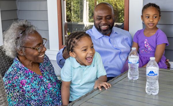 (left to right) Mary Durden watches her grandson Frederick "Tre" (age 3) laugh and squirm while being tickled by his father Frederick as his sister Zoe (age 5) sits with them on the porch of their Newnan home. Dr. Frederick Durden has been surrounded by great mentors since childhood and is now taking all the influence and encouragement he received and is channeling outward. He has great humility and perspective and wants to serve others as he's been served throughout his life. Despite a busy career as a plastic surgeon, he is also a devoted husband, father of three young children, and makes times to lead cancer support groups at his church (and much more). PHIL SKINNER FOR THE ATLANTA JOURNAL-CONSTITUTION.