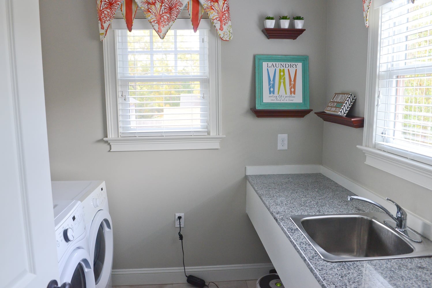 Laundry room with orange hues