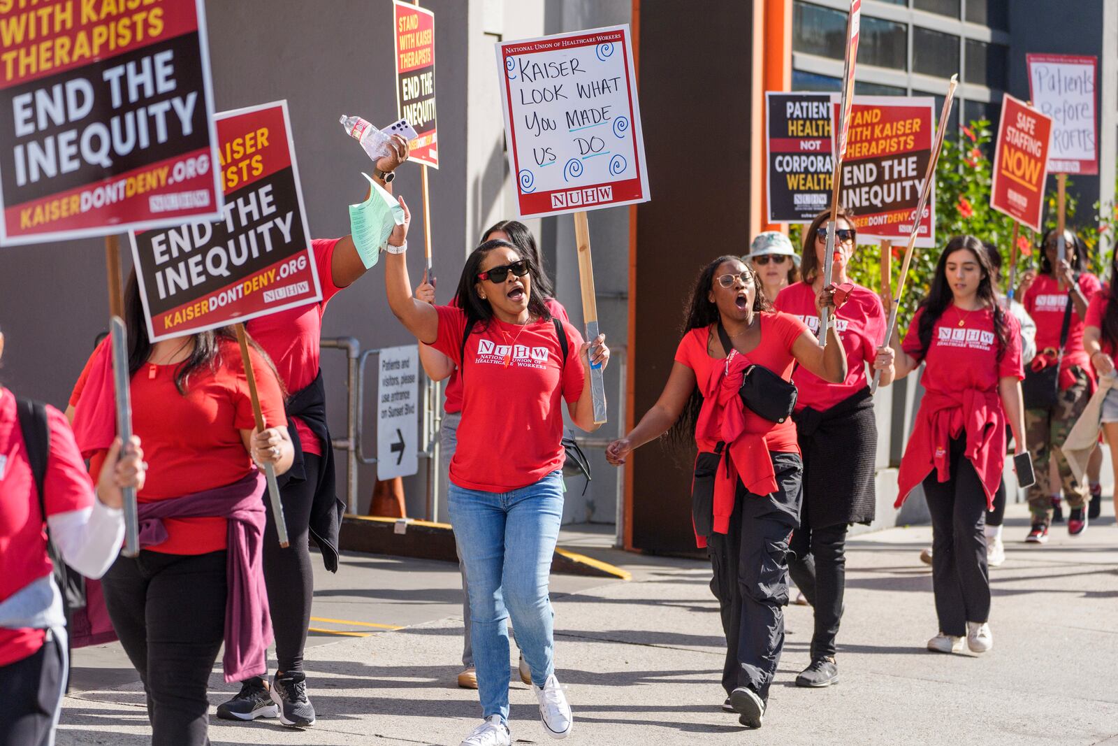 Mental health workers strike outside a Kaiser Permanente facility in Los Angeles Monday, Oct. 21, 2024. (AP Photo/Damian Dovarganes)