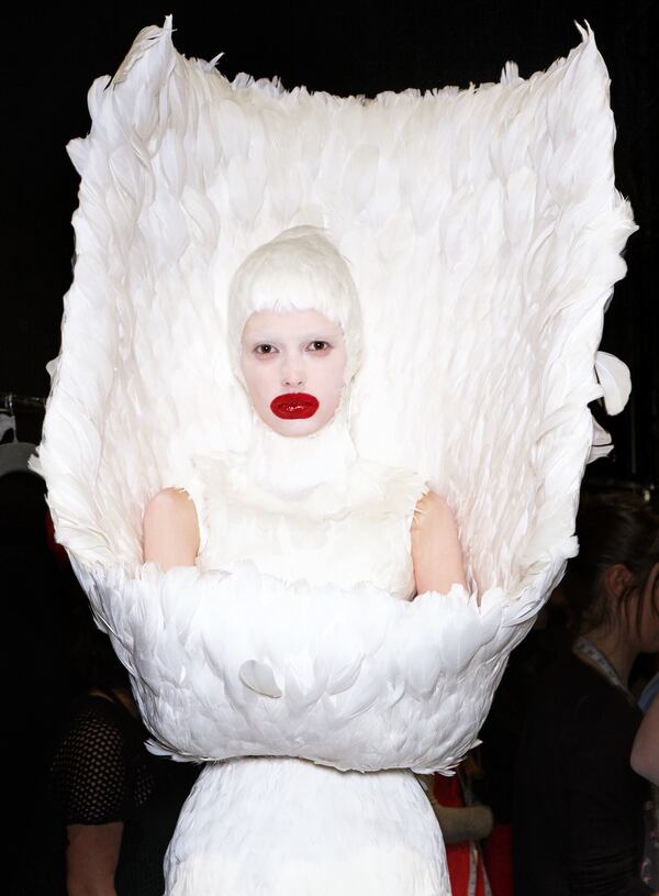 Alexander McQueen’s darkly romantic side is seen in this over-the-top look, photographed backstage at “The Horn of Plenty” show.