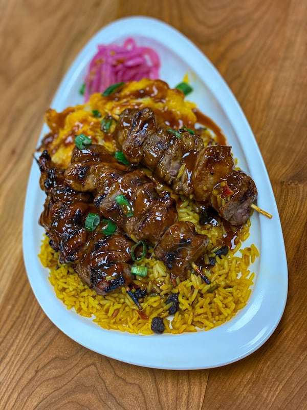 Baked Kitchen Sosaties are cubed lamb and apricot skewers served here over wild rice and mac 'n cheese. (Courtesy of Baked Kitchen)