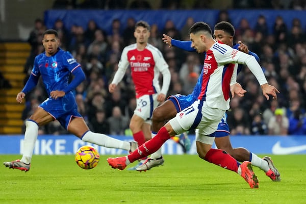 Arsenal's Gabriel Martinelli attempts a shot at goal during the English Premier League soccer match between Chelsea and Arsenal at Stamford Bridge stadium in London, Sunday, Nov. 10, 2021. (AP Photo/Kirsty Wigglesworth)