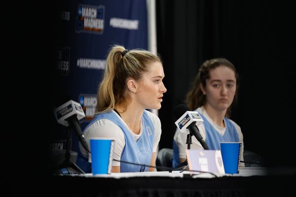 Columbia guard Kitty Henderson answers a question at an NCAA Tournament press conference as teammate Cecelia Collins looks on in Chapel Hill, N.C., Wednesday, March 19, 2025, before their First Four basketball game in the NCAA Tournament against Washington on March 20. (AP Photo/Nell Redmond)