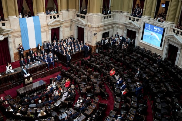 Argentina's President Javier Milei, left, delivers the annual State of the Nation address, which marks the start of the legislative year, in Buenos Aires, Argentina, Saturday, March 1, 2025. (AP Photo/Rodrigo Abd)