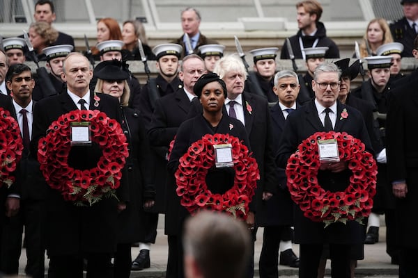 From left: Britain's former Prime Minister Rishi Sunak, Liberal Democrat leader Sir Ed Davey, former Prime Minister Liz Truss, leader of the opposition Kemi Badenoch, former Prime Minister Boris Johnson, Mayor of London Sadiq Khan and Prime Minister Sir Keir Starmer attend the National Service of Remembrance at The Cenotaph in London, England, Sunday, Nov. 10, 2024. (Aaron Chown/PA via AP)