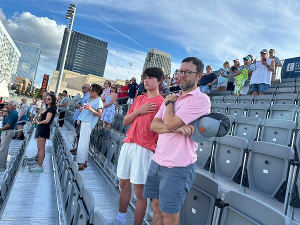 Alex and Trey Nelson of Birmingham stand for the National Anthem before an exhibition match at The Atlanta Open at Atlantic Station Monday, July 22, 2024. RODNEY HO/rho@ajc.com