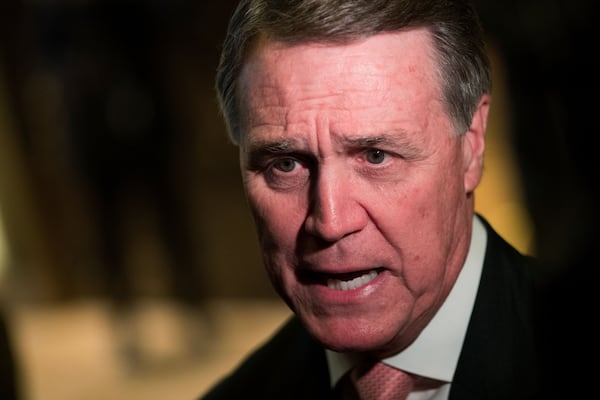 U.S. Sen. David Perdue speaks to reporters at Trump Tower in New York in early December. (Drew Angerer / Getty Images)