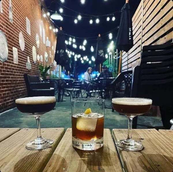 Cocktails offered by Thinking Man Tavern include (from left) a Rockaway Beach, a witchy woman and a purple rain. (Courtesy of Davy Minor)