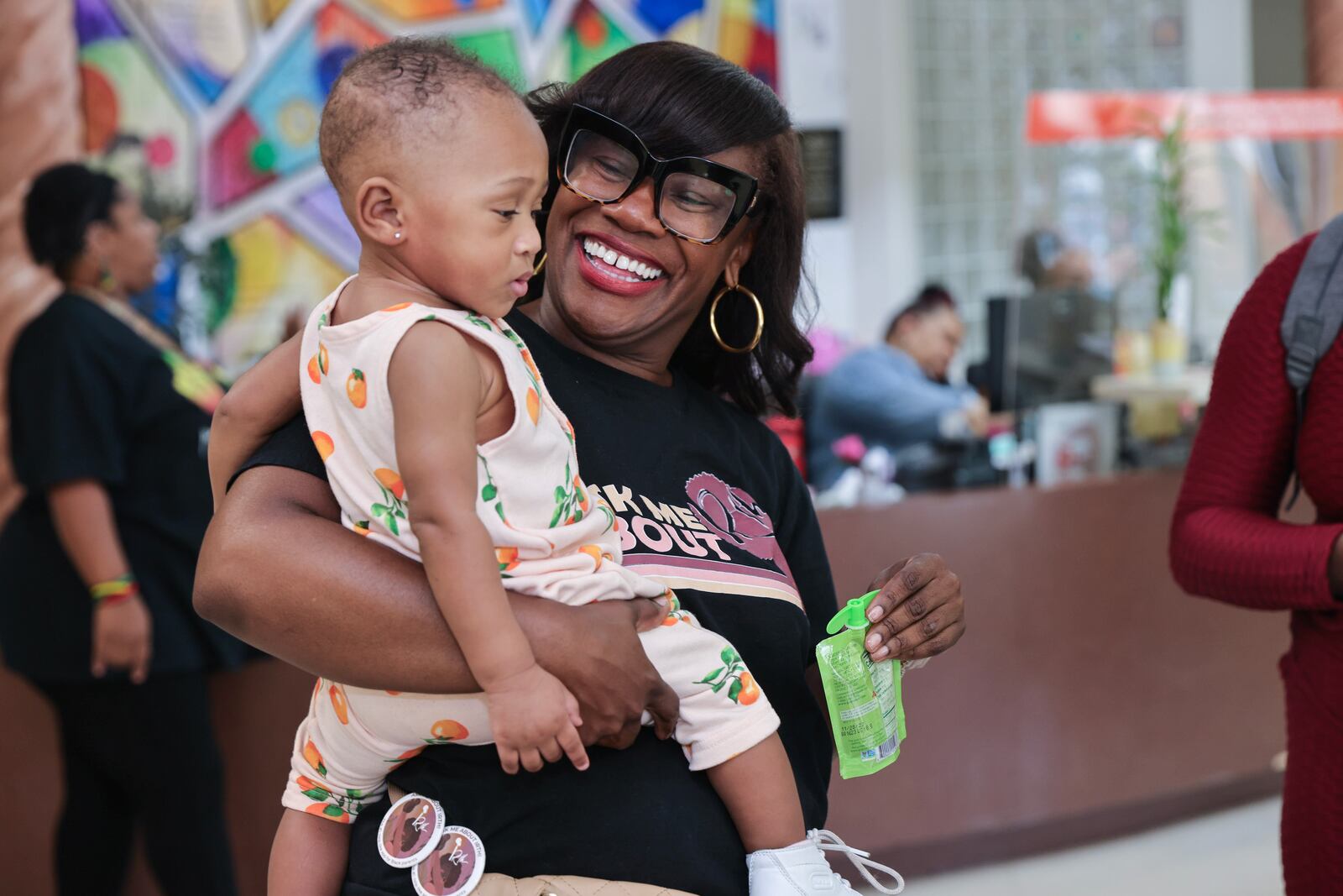 Kimberly Seals Allers, creator of an app called Irth holds ten-month-old Kyomi Williams during a launch event at Sheltering Arms Educare Center on Thursday, June 15, 2023. The app is  “Yelp-like” review and rating platform for Black mothers to share birthing experiences to help make Black birth safer. (Natrice Miller/ Natrice.miller@ajc.com)