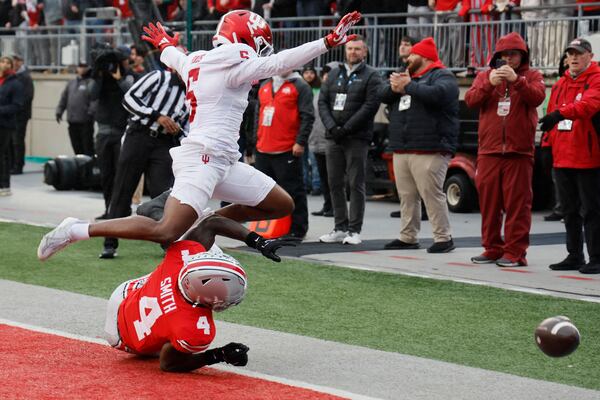 Indiana defensive back D'Angelo Ponds, top, breaks up a pass intended for Ohio State receiver Jeremiah Smith during the first half of an NCAA college football game Saturday, Nov. 23, 2024, in Columbus, Ohio. (AP Photo/Jay LaPrete)