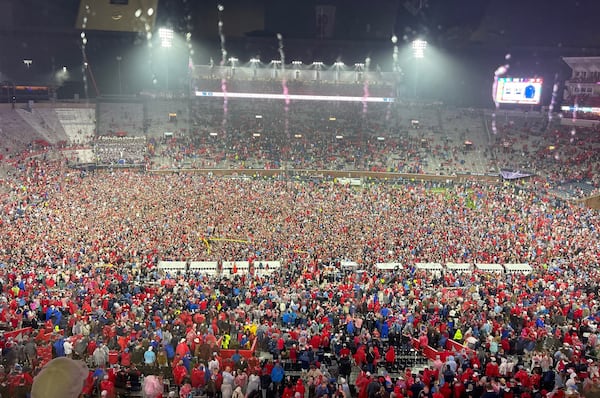 Ole Miss fans stormed the field at Vaught-Hemingway Stadium Saturday night and tore down both goal posts after the 16th-ranked Rebels upset No. 3 Georgia 28-10 before a rain-soaked record crowd. (Photo by Chip Towers/ctowers@ajc.com)