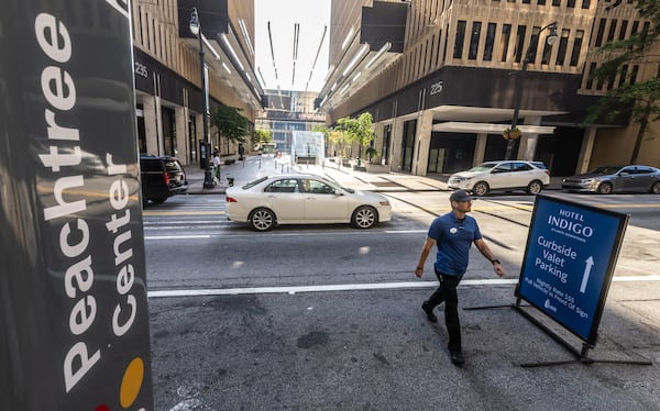 Peachtree Center in downtown Atlanta is seen returning to business Wednesday morning, June 12, 2024 after a shooting on Tuesday afternoon left the suspect and three other people injured. (John Spink/AJC)