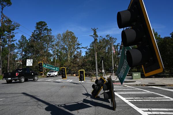 Fallen traffic signals and wires are seen near Valdosta State University, Saturday, Sept. 28, 2024, in Valdosta. The devastation in Valdosta was extensive after the South Georgia city was battered with hurricane-force winds on Helene’s path across the state. Damaging Helene has swept through Georgia, leading to at least 17 deaths. All 159 counties are now assessing the devastation and working to rebuild, even as serious flooding risks linger. (Hyosub Shin / AJC)