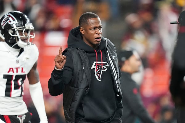 Atlanta Falcons head coach Raheem Morris walks on the field before an NFL football game against the Washington Commanders, Sunday, Dec. 29, 2024, in Landover. (AP Photo/Stephanie Scarbrough)